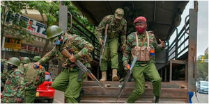General Service Unit officers alight from their lorry, ready to repel protesters in Nairobi.